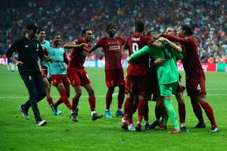 Liverpool goalkeeper Adrian is congratulated by his team-mates and manager Jurgen Klopp after his heroics in the UEFA Super Cup win against Chelsea in August 2019.