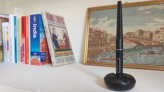A pen for a Huion Inspiroy Giano drawing tablet standing on a shelf