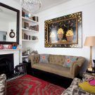 eclectic living room with white wall open book shelve and table lamp
