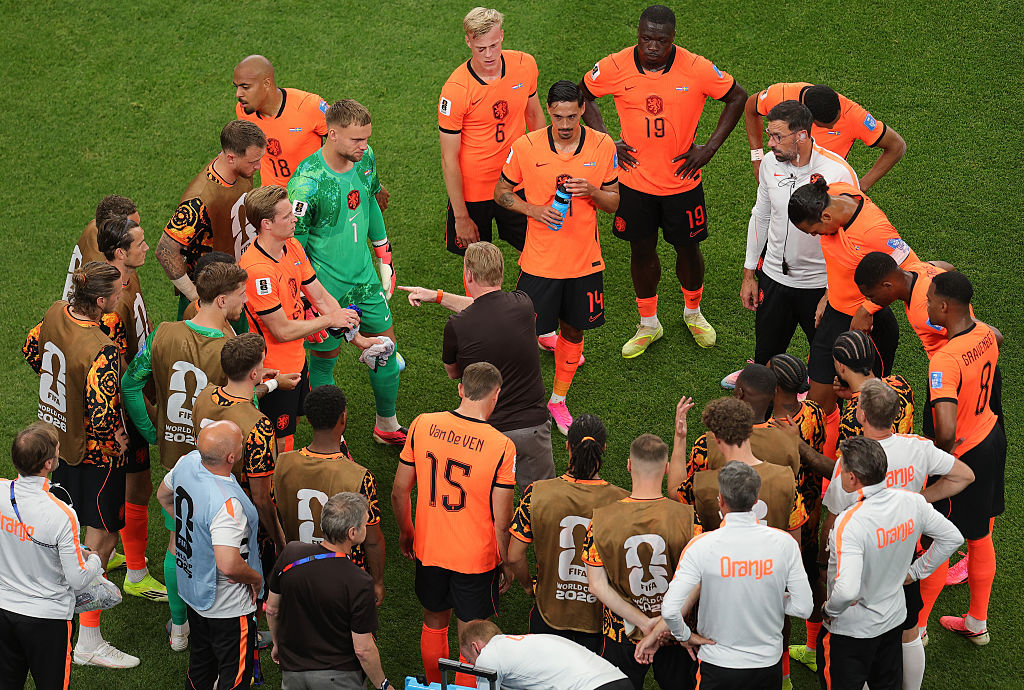 Ronald Koeman, Head Coach of the Netherlands, speaks to players at the hydration break 
