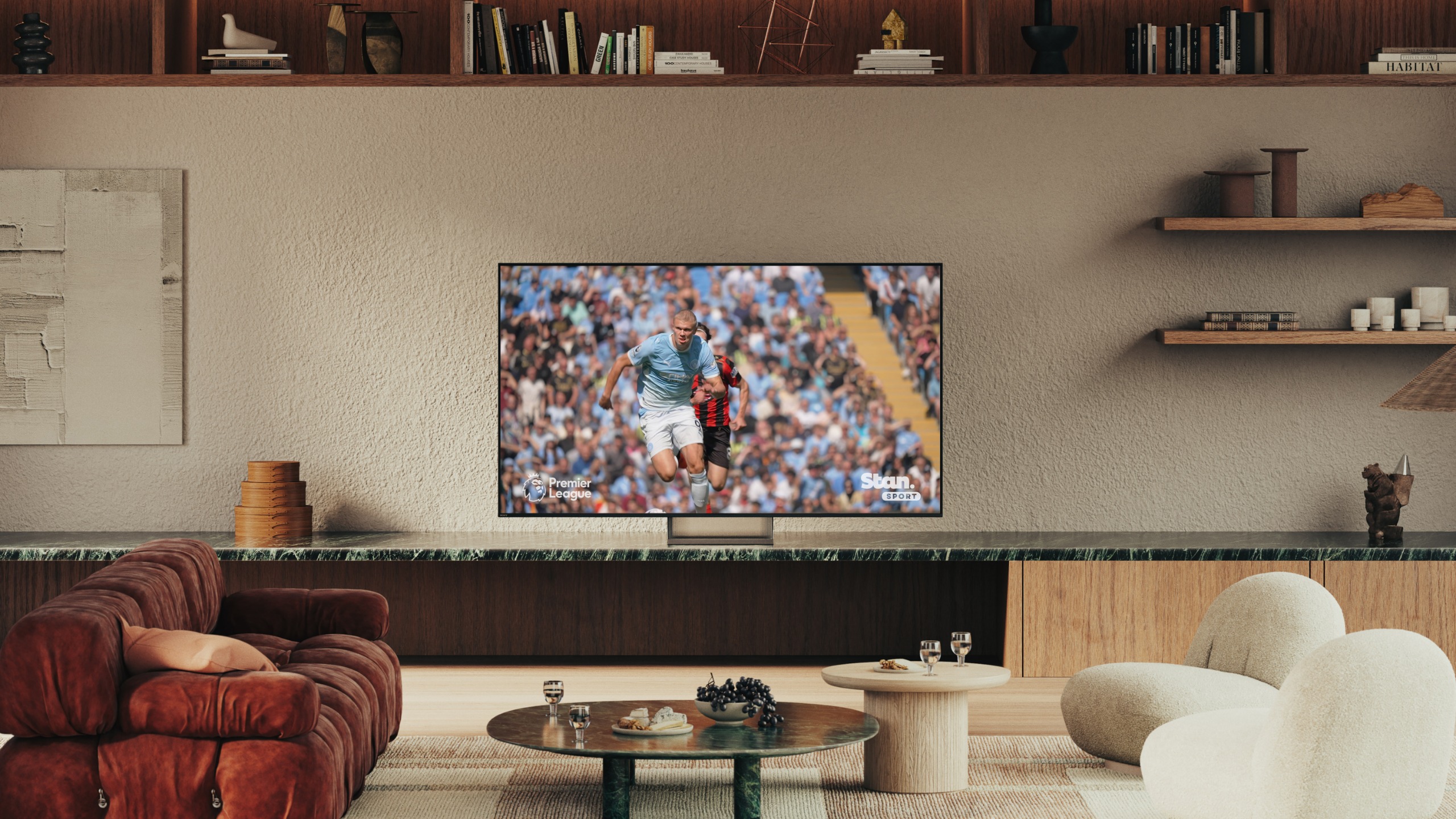 Sony True RGB TV standing on a media unit in a living room setting, displaying sports content.