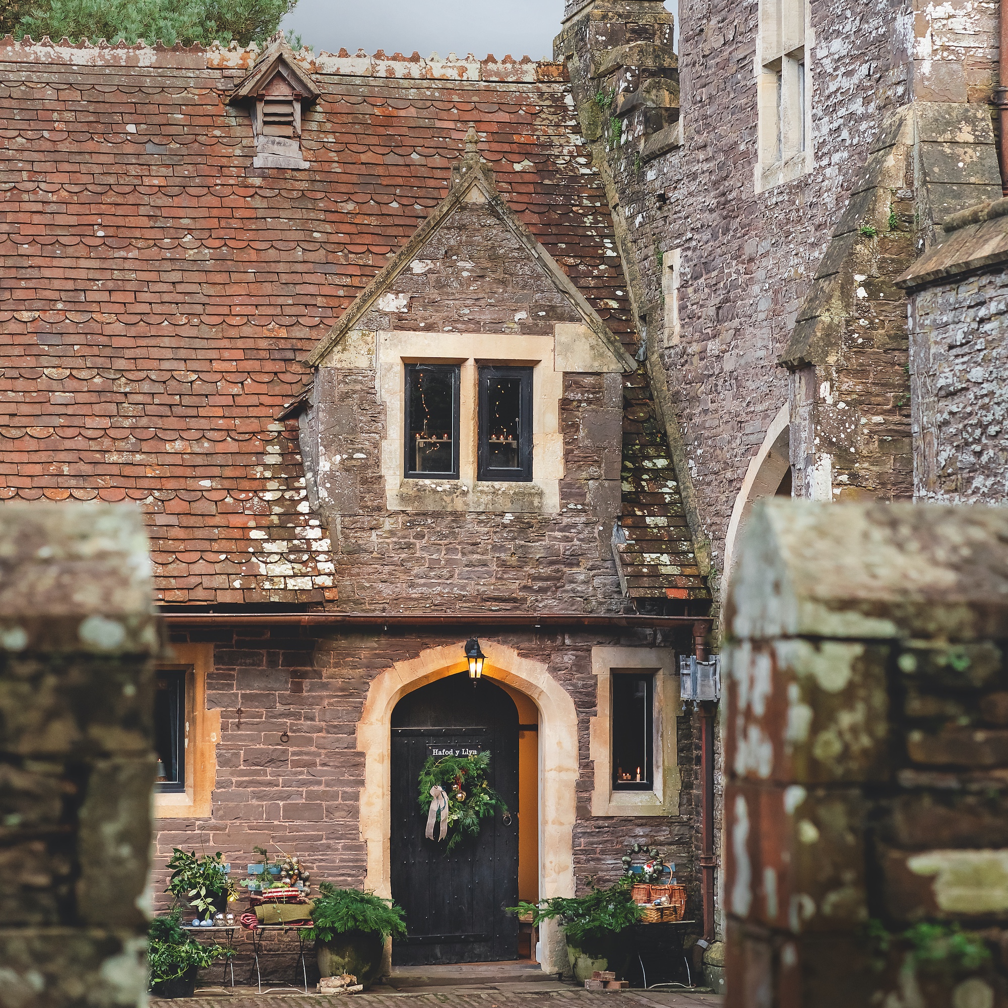 exterior of converted victorian stables with studded oak door
