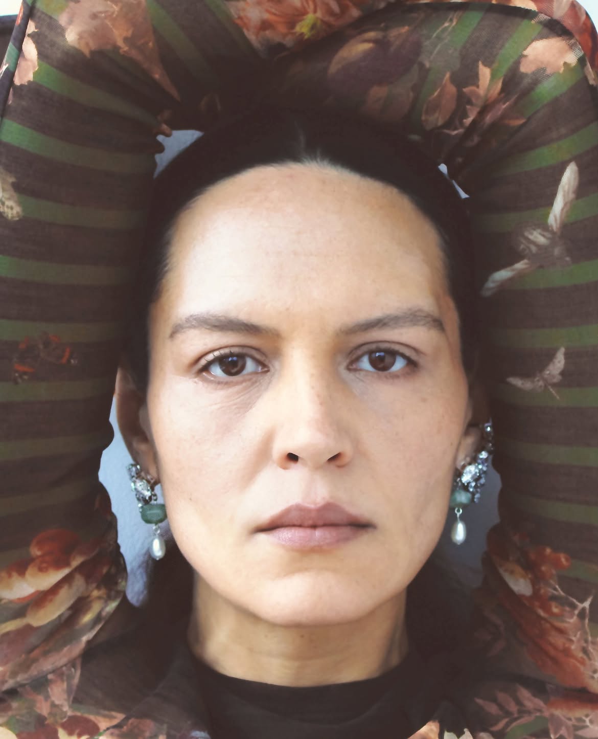 Completedworks model wears earrings