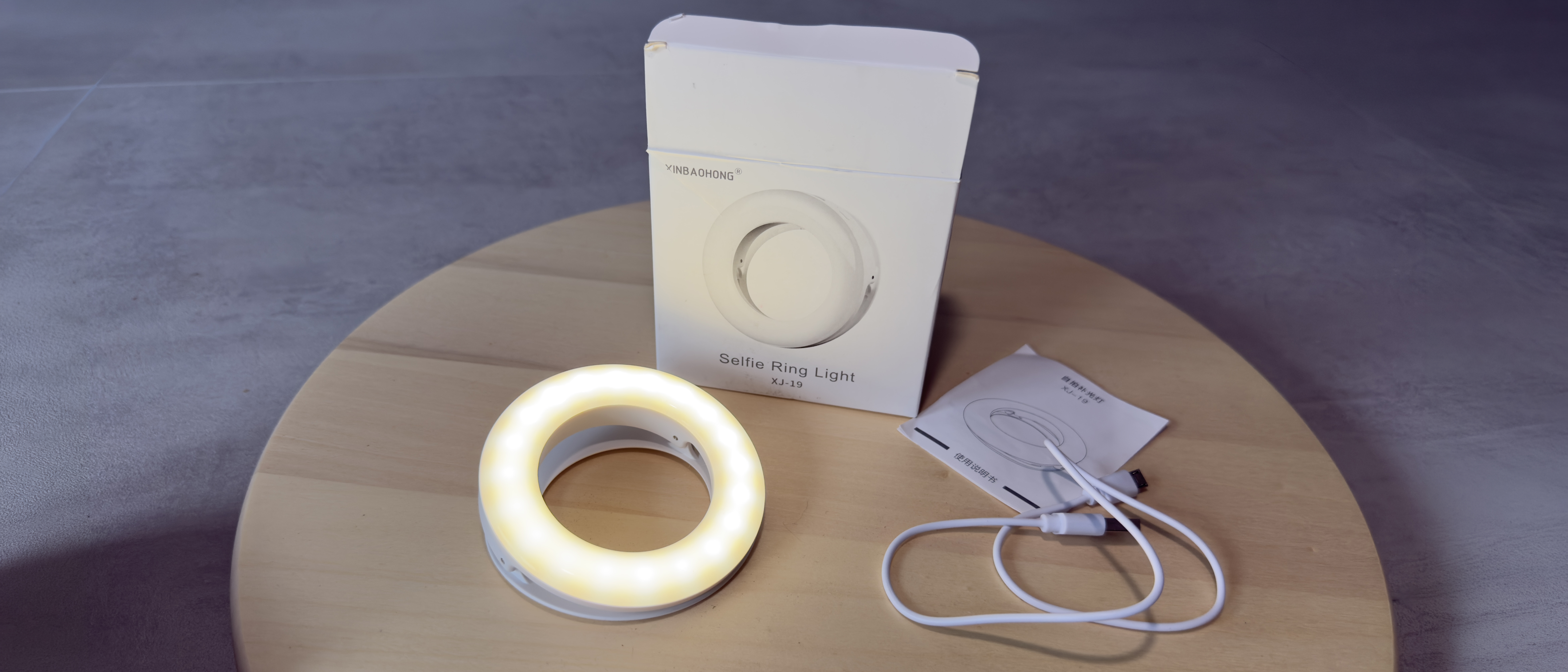 AJ-19 Selfie Ring Light with packaging in a 21x9 format image