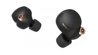 A pair of the sony wf-1000xm4 true wireless earbuds in black