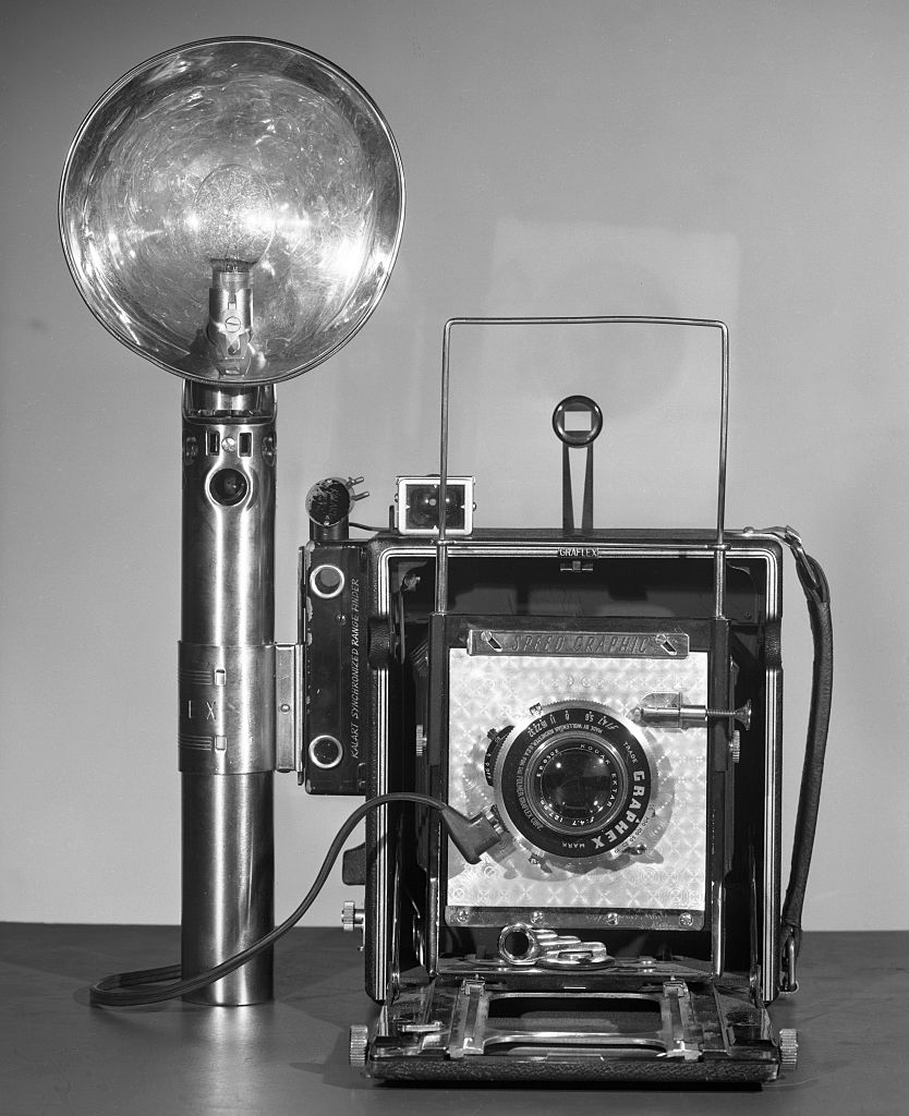 NEW YORK - APRIL 3: A Graflex Speed Graphic camera, with flash. New York, NY. Image dated April 3, 1951.