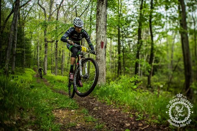 Drew Edsall pulls a wheelie on the bottom of the enduro segment of Stage 5