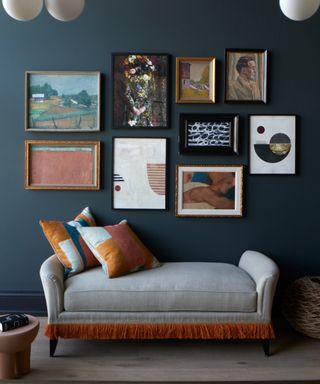 discovering your interior design style, gallery wall on navy wall, chaise longue, block color cushions, retro pendants