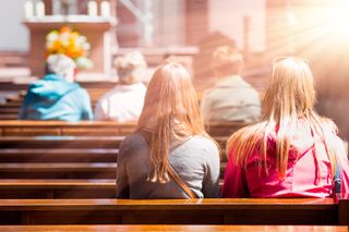 People praying at church