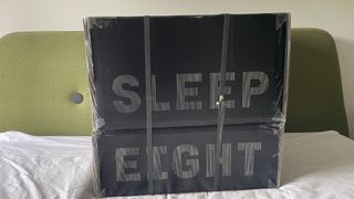 Eight Sleep Pod 3 in its boxes on the bed