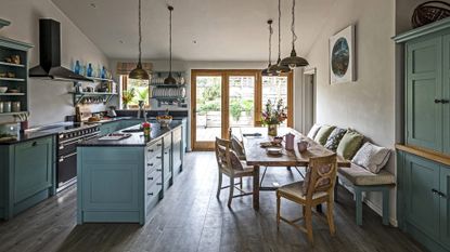 kitchen area with cabinets and dining table