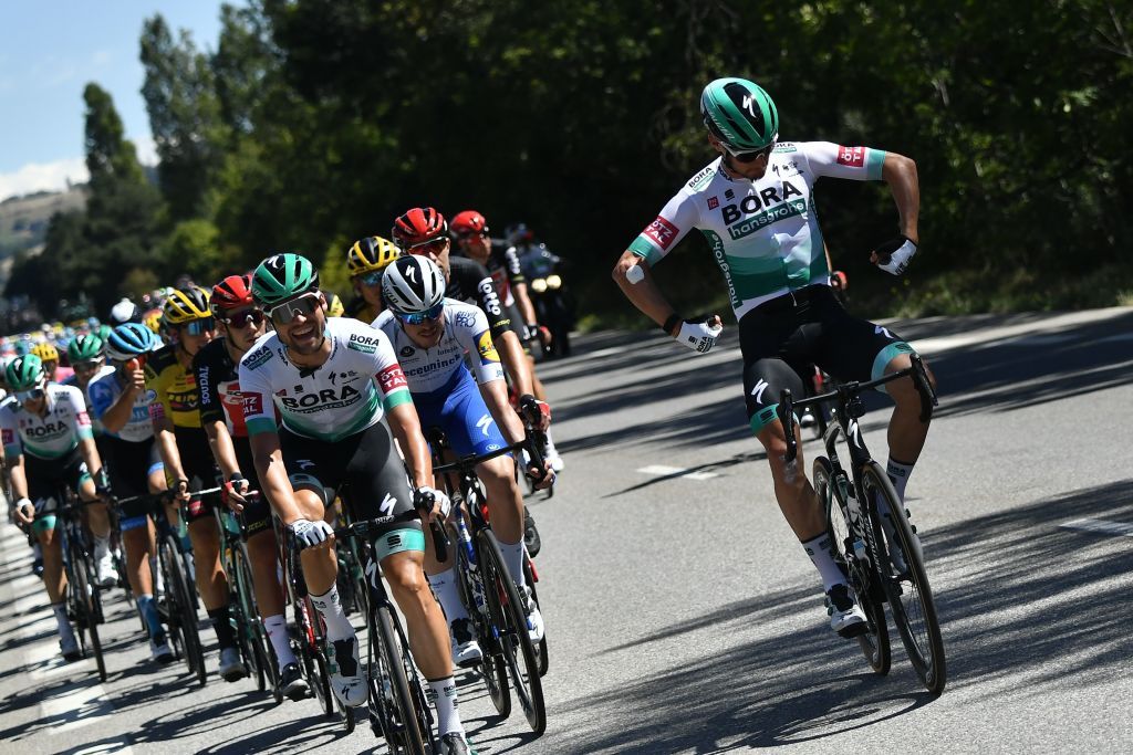 Team Bora rider Austrias Lukas Postlberger R jokes next to Team Bora rider Germanys Maximilian Schachmann as they ride during the 5th stage of the 107th edition of the Tour de France cycling race 185 km between Gap and Privas on September 2 2020 Photo by Marco Bertorello AFP Photo by MARCO BERTORELLOAFP via Getty Images