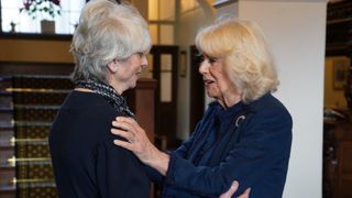 Queen Camilla (right) meets Diana Parkes CBE who founded Joanna Simpson Foundation, during a visit to Government House, in Onchan, Isle of Man in 2024