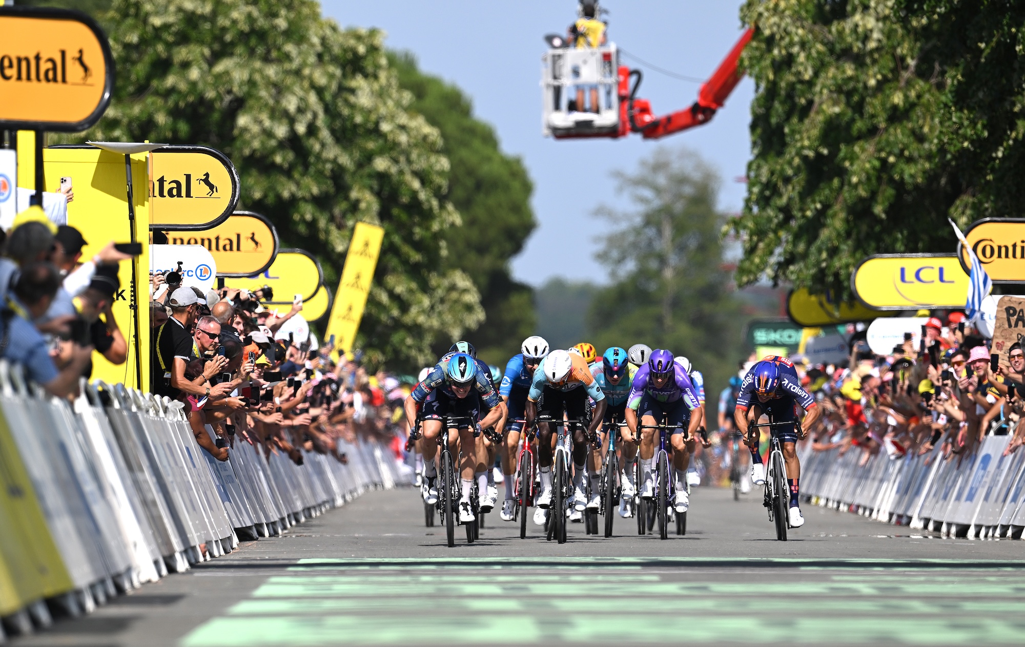 Stage winner Tim Merlier of Belgium and Team Soudal Quick-Step, Biniam Girmay of Eritrea and Team NSN Cycling, Pascal Ackermann of Germany and Team Jayco AlUla and Pavel Bittner of Czech Republic and Team Picnic PostNL sprint at finish line during the 113th Tour de France 2026, Stage 8