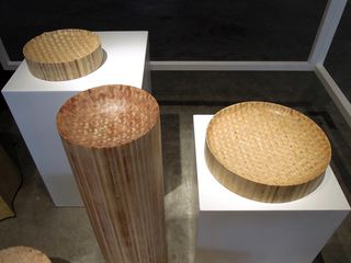 View of 'Extrusion Series' by Philippe Malouin - circular wooden pieces of varying heights with patterns