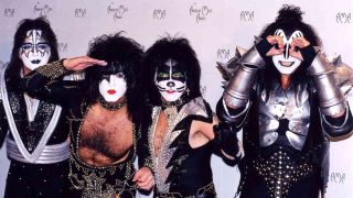 The reunited Kiss posing for a photograph in 1998