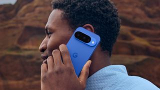 Google Pixel 10 held to user's head