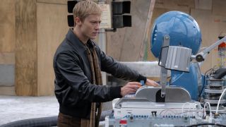 Joseph Quinn stands intrigued by a high tech console in The Fantastic Four: First Steps.