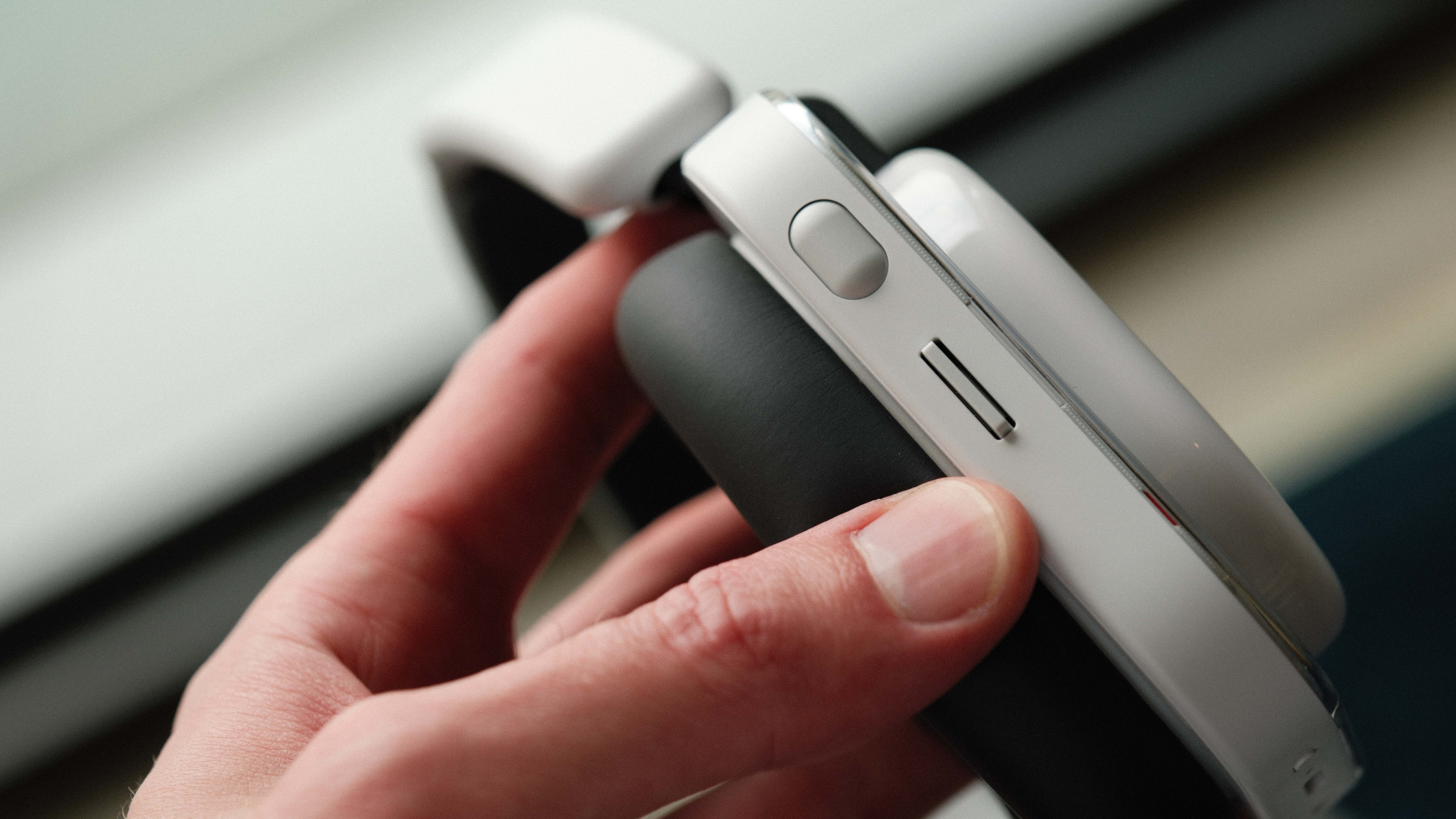 Close-up of Nothing Headphones (a) control buttons