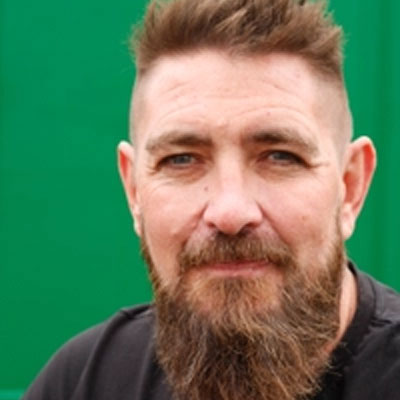 headshot of Jon Butterworth of Arada a stove expert with a beard