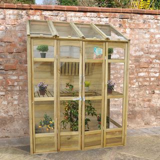 red brick wall wooden frame cabinet with plant pots