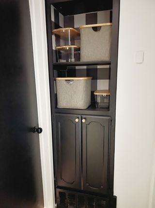 Peel and stick plaid wallpaper in grey to update old built-in hallway cabinet