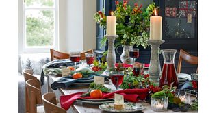 Dining table styled for Christmas with a floral centrepiece