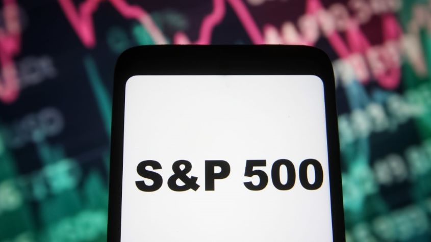 a S&amp;amp;P 500 words are seen on a smartphone screen