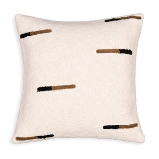 cut out of white cushion with brown and black lines