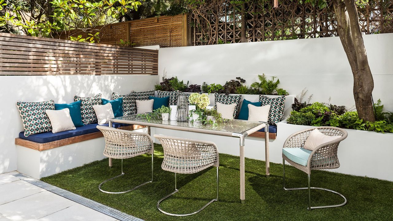 garden area with patio table and couch