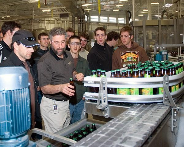Ken Grossman leads riders on a tour of Sierra Nevada's new bottling facility.