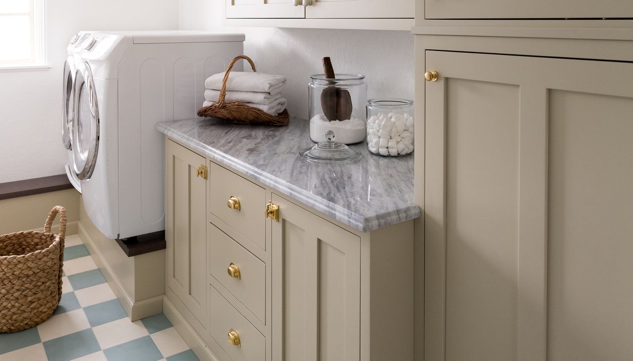 a laundry room with a raised washer dryer