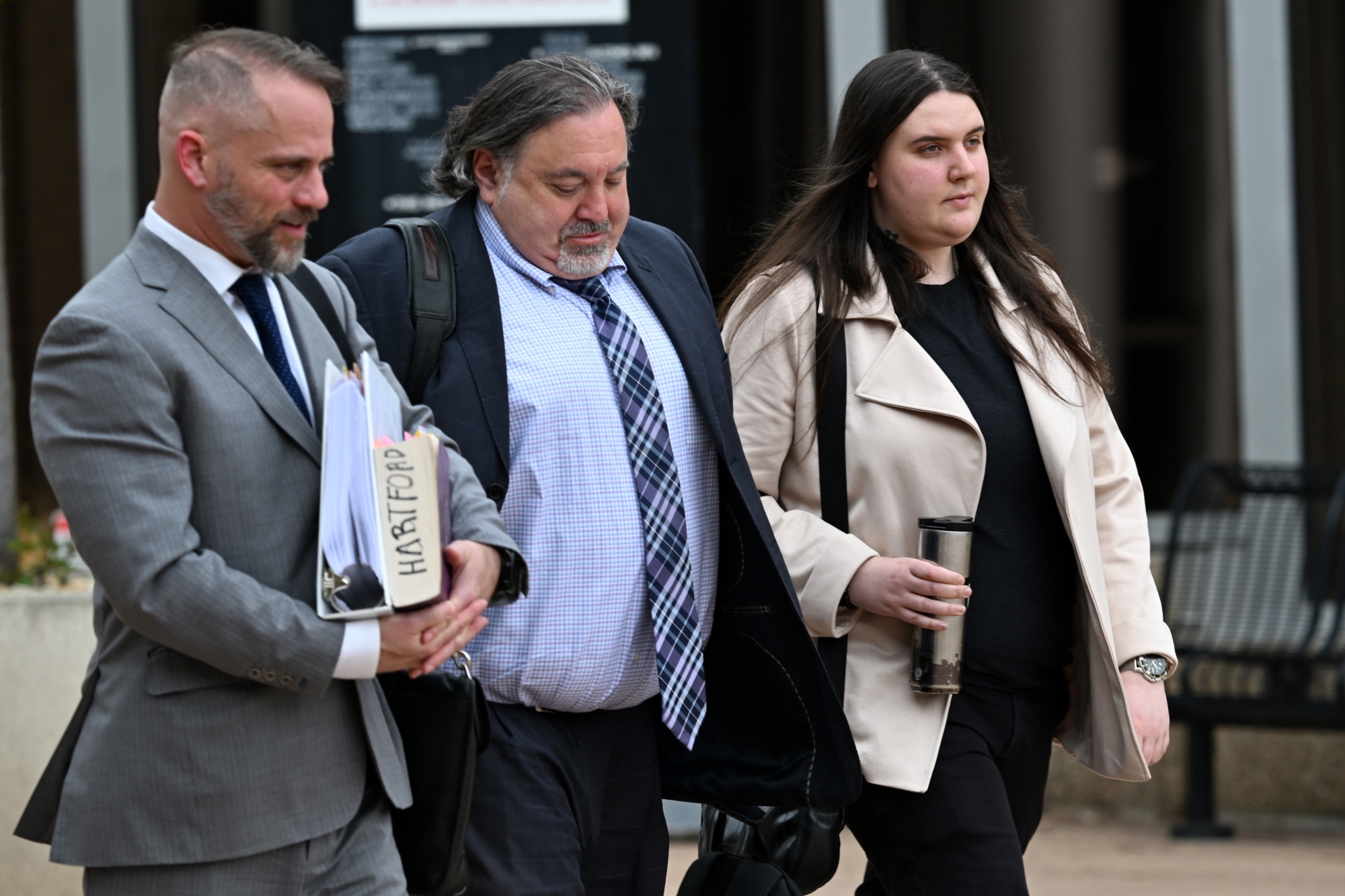 Yeva Smilianska, right, walks out of the Boulder County Courthouse with her lawyers. Yeva Smilianska faced charges of vehicular homicide for killing competitive cyclist Magnus White in 2023