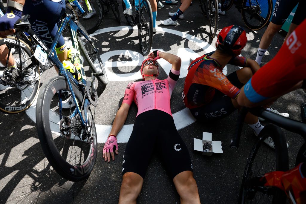 BILZEN BELGIUM AUGUST 27 LR Lukasz Wisniowski of Poland and Team EF EducationEasypost Michal Kwiatkowski of Poland and Team INEOS Grenadiers and the peloton stopped at the finish line to protest as riders deem the course as being too dangerous during the 19th Renewi Tour 2023 Stage 5 a 1873km stage from Riemst to Bilzen UCIWT on August 27 2023 in Bilzen Belgium Photo by Bas CzerwinskiGetty Images