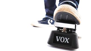 Foot on a Vox wah pedal