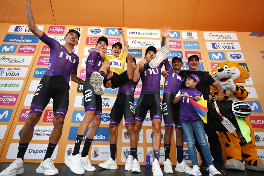 Team Nu Colombia celebrate at podium as best team winners