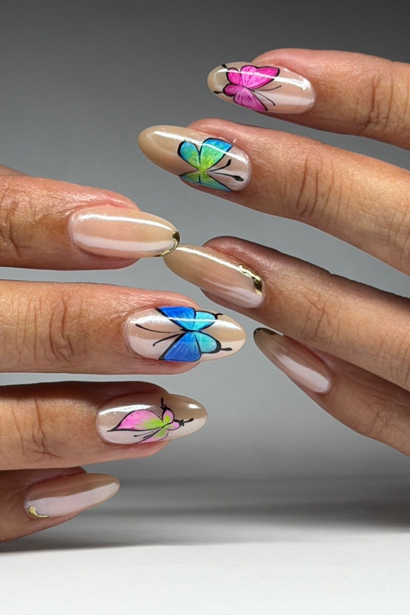 A Y2K butterfly manicure.