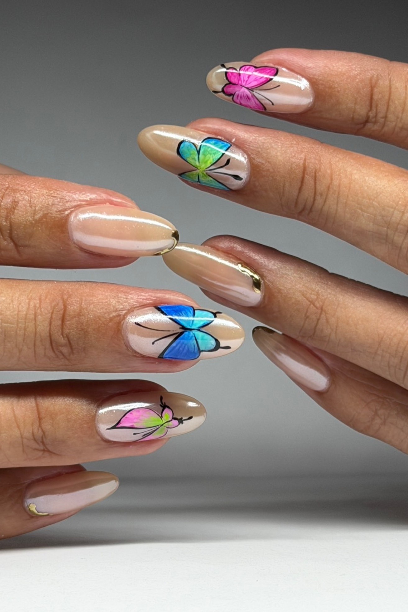 A Y2K butterfly manicure.
