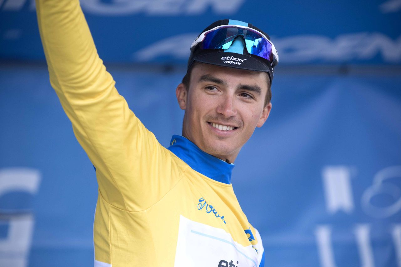 Julian Alaphilippe (Etixx-Quickstep) waves from the podium