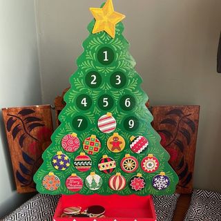 Toy advent calendar illustrated by green wooden tree