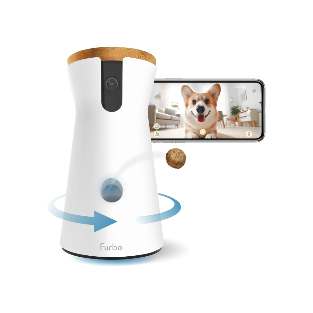 Furbo 360&deg; View Camera, one of the best pet cameras, shooting out a treat next to a phone displaying an image of a dog