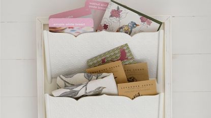white colour hanging storage and letters