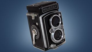 The Rolleiflex Twin Lens Reflex camera on a blue background