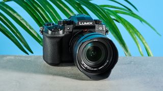 A black Panasonic Lumix G97 mirrorless camera