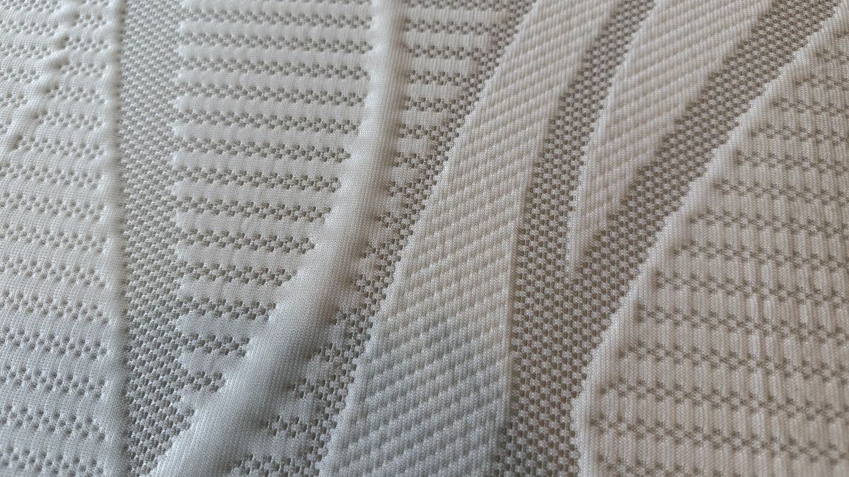 A close up of the cover of the Nectar topper
