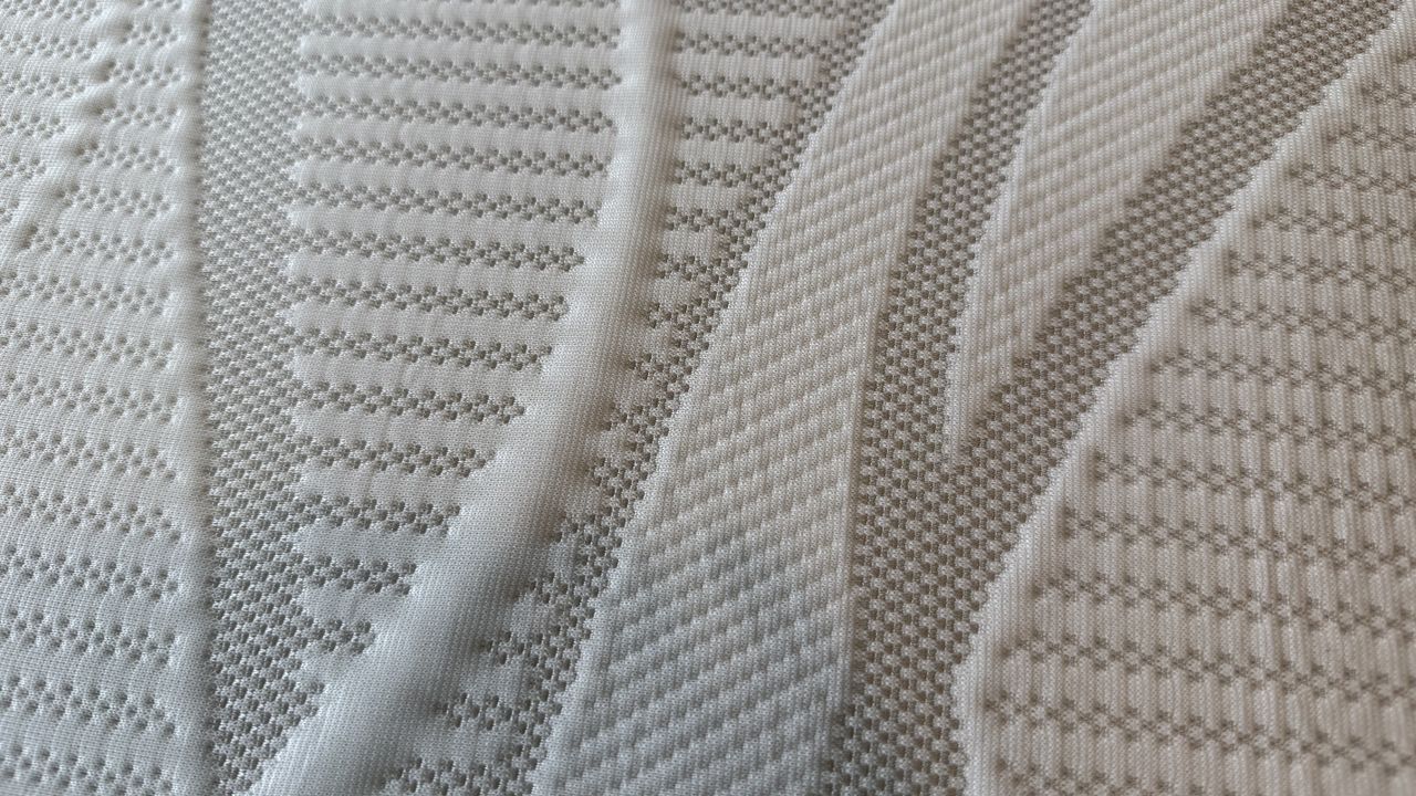 A close up of the cover of the Nectar topper