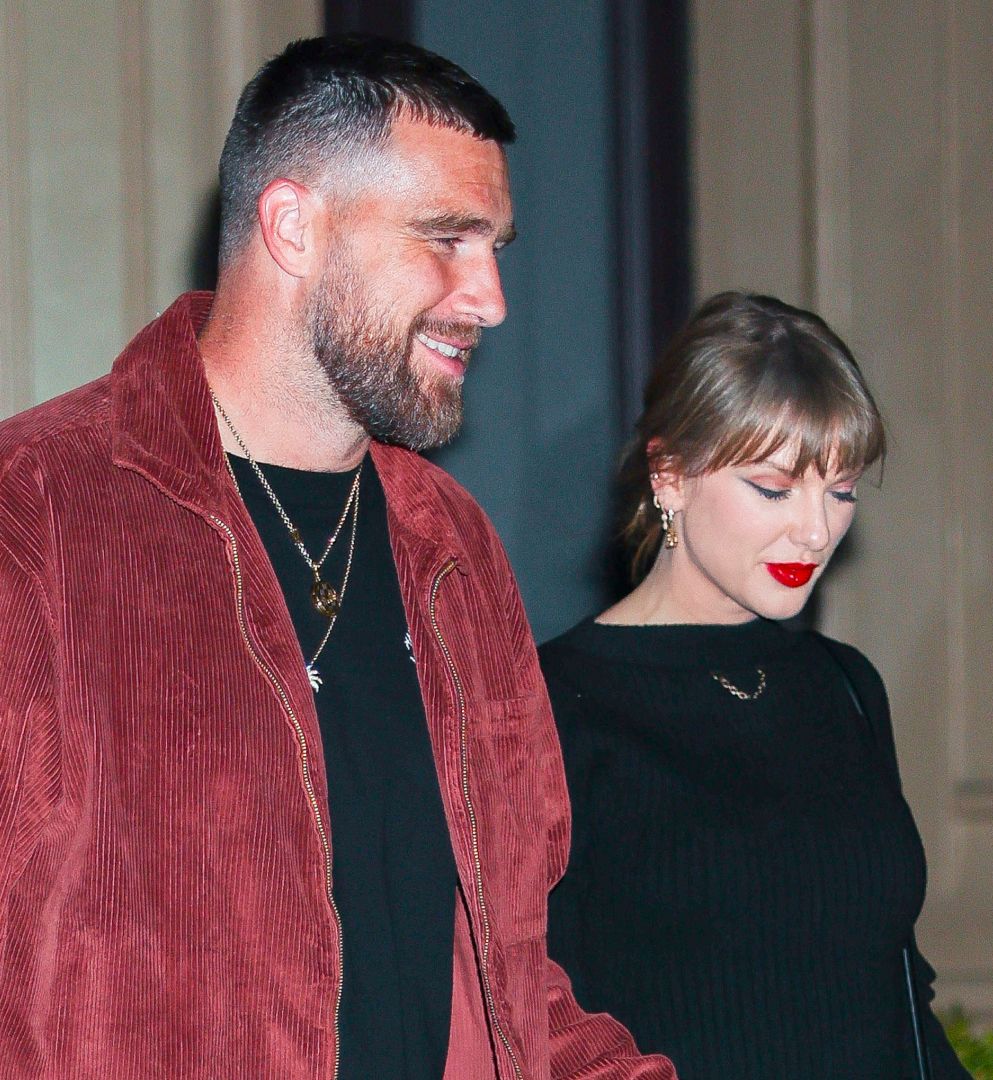Taylor Swift in a black outfit and Travis Kelce in a red jacket and black T-shirt in NoHo on November 06, 2025 in New York City
