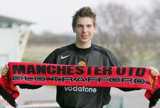 Ron-Robert Zieler poses with a Manchester United scarf after joining Manchester United on a Schlorship Scheme in July 2005, on February 25, 2005 at Carrington Training Ground in Manchester, England.