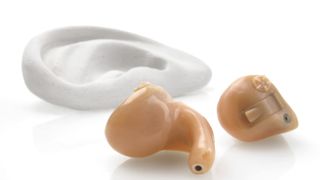 This model shows a pair of in-the-ear hearing aids.