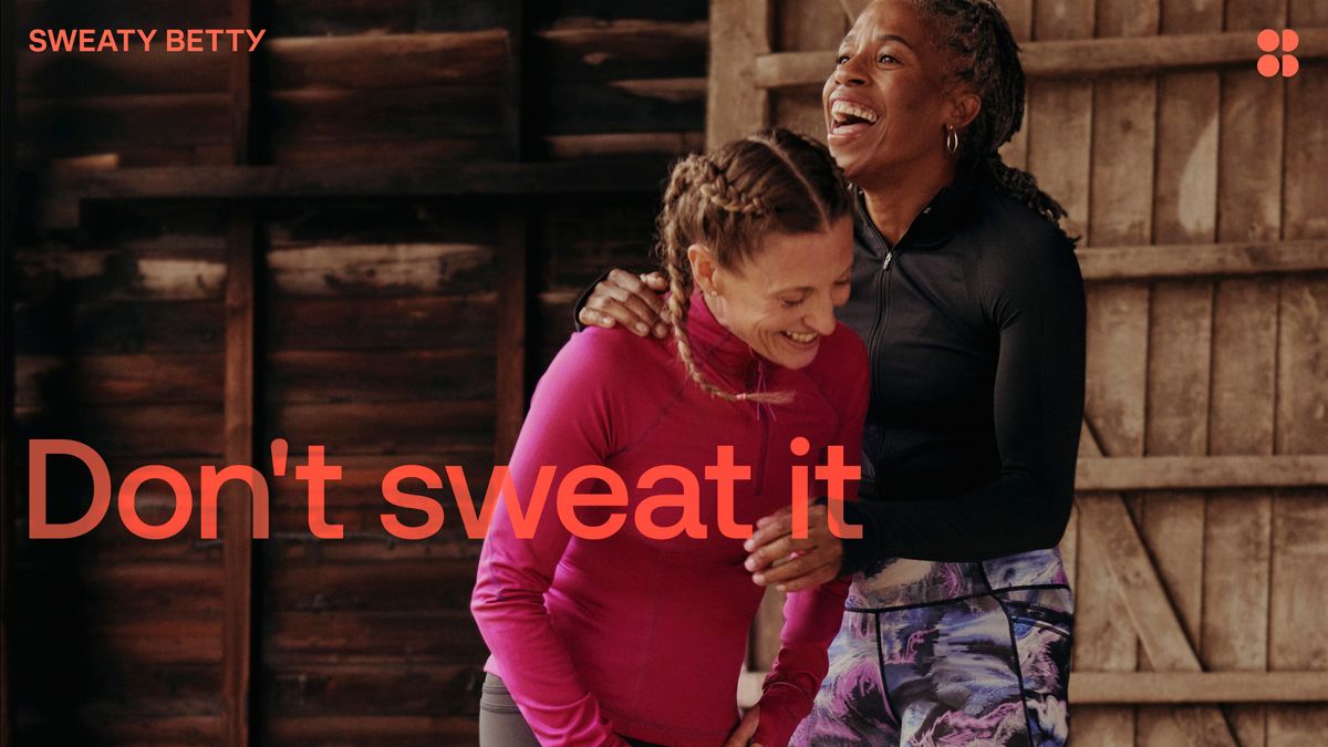 Two people hugging with don't sweat it tag